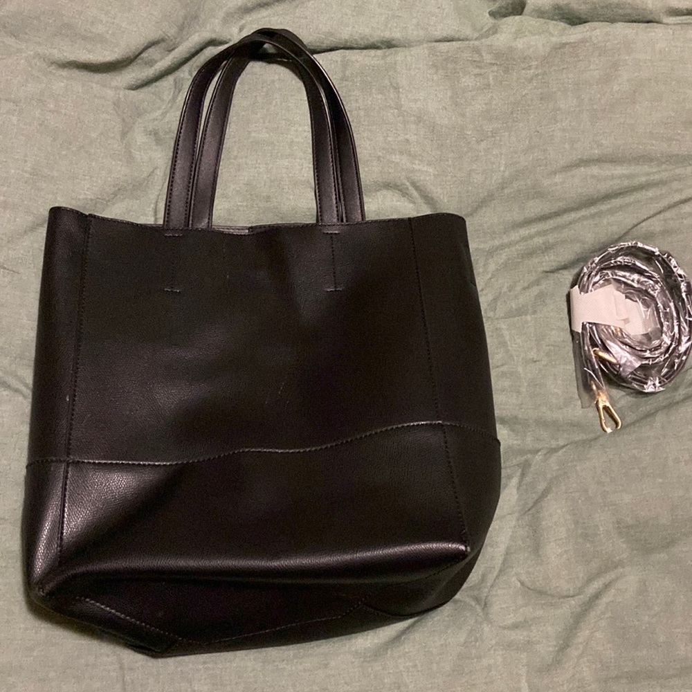 Black tote with new and unused shoulder strap